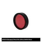 Red bandpass filter with black rim on a white background